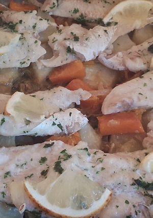 Una foto de Merluza al horno con papas