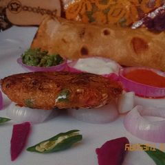 A picture of Peshawari baingun k chapli kabab.