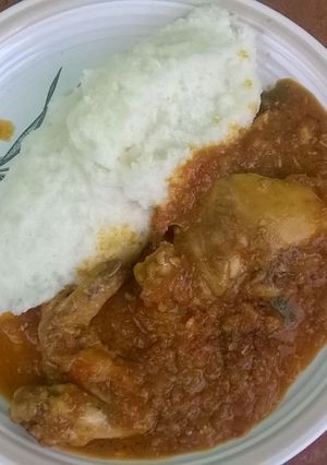 A picture of Chicken pieces in tomato.