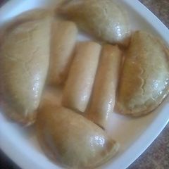 A picture of Beef pie and fish rolls (baked).