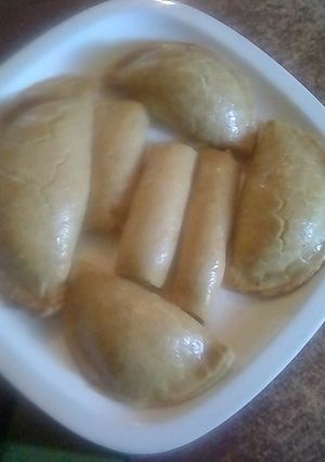 A picture of Beef pie and fish rolls (baked).