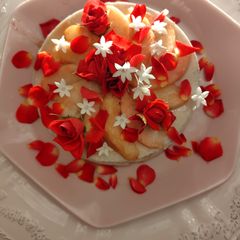 A picture of Peach mousse, red roses and white flowers bouquet.