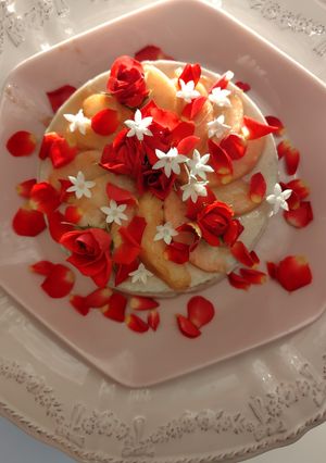 A picture of Peach mousse, red roses and white flowers bouquet.
