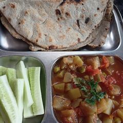 A picture of Lauki ki sabzi with bajra roti.
