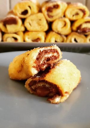 Une photo de Roulés de pain de mie au nuttela façon pain perdu