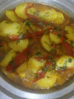A picture of Tagine with Potatoes and Bell Peppers.