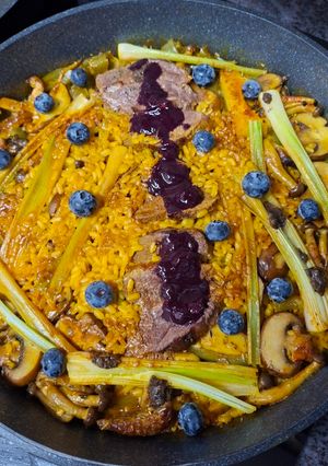 A picture of Duck Breast Paella with Cranberries.