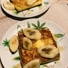 A picture of Banana toast with honey and butter.