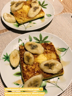 A picture of Banana toast with honey and butter.