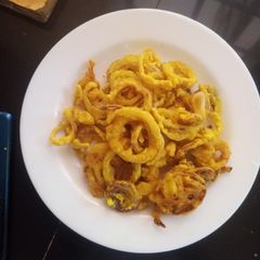 A picture of Tumeric onion rings.