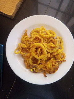A picture of Tumeric onion rings.