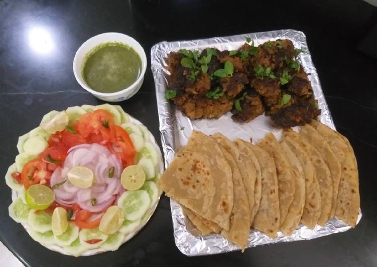 Mutton kababs and parathas with curd chattny and salad