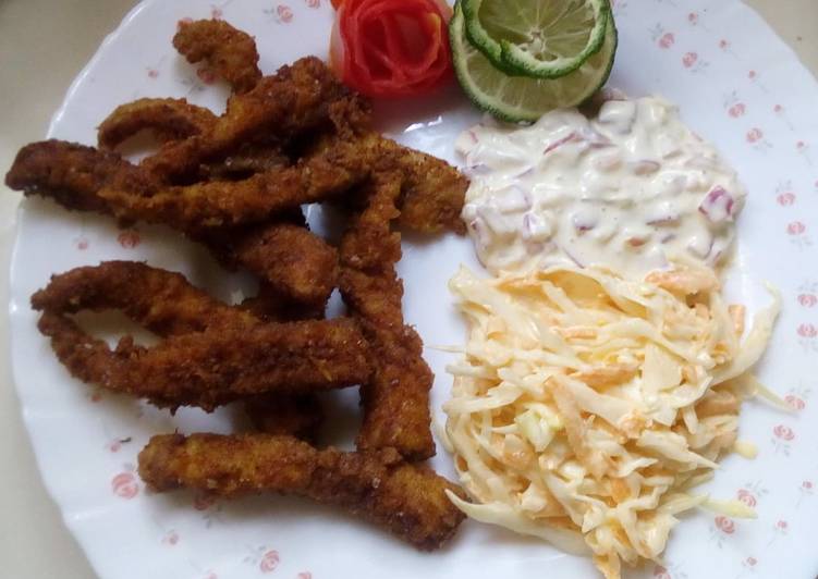 Simple fish fingers with tartar sauce and coleslaw