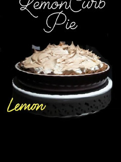 Una foto de Tarta de cuajada de limón y merengue flameado