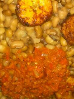 A picture of Bean with plaintain and fried stew.
