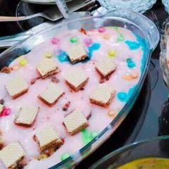 A picture of Strawberry custard with cooktail.