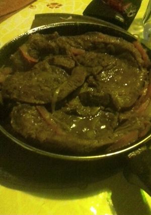 Una foto de Bife a la criolla
