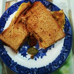 A picture of Veg omelette with brown bread.