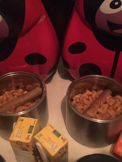 A picture of Macaroni with fried chicken and sausage.