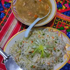 A picture of Chinese rice with chicken Chilli.