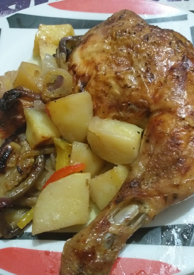 Una foto de Cuartos traseros de pollo con verduras a la silla