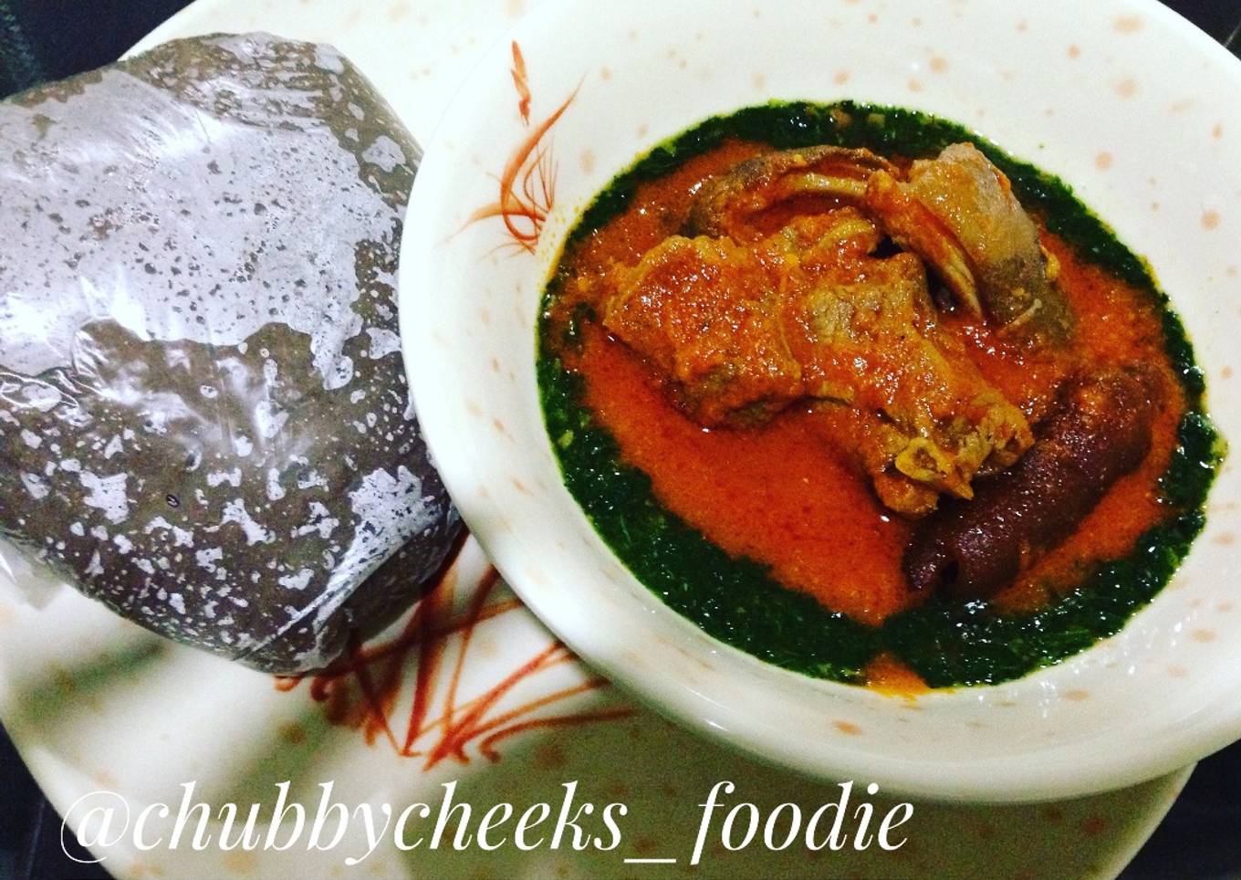 Ewedu and palmoil stew with amala