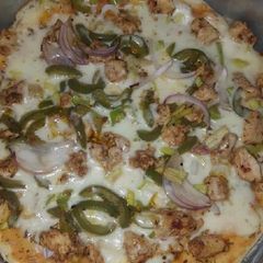 A picture of Chickn tikka pizza.