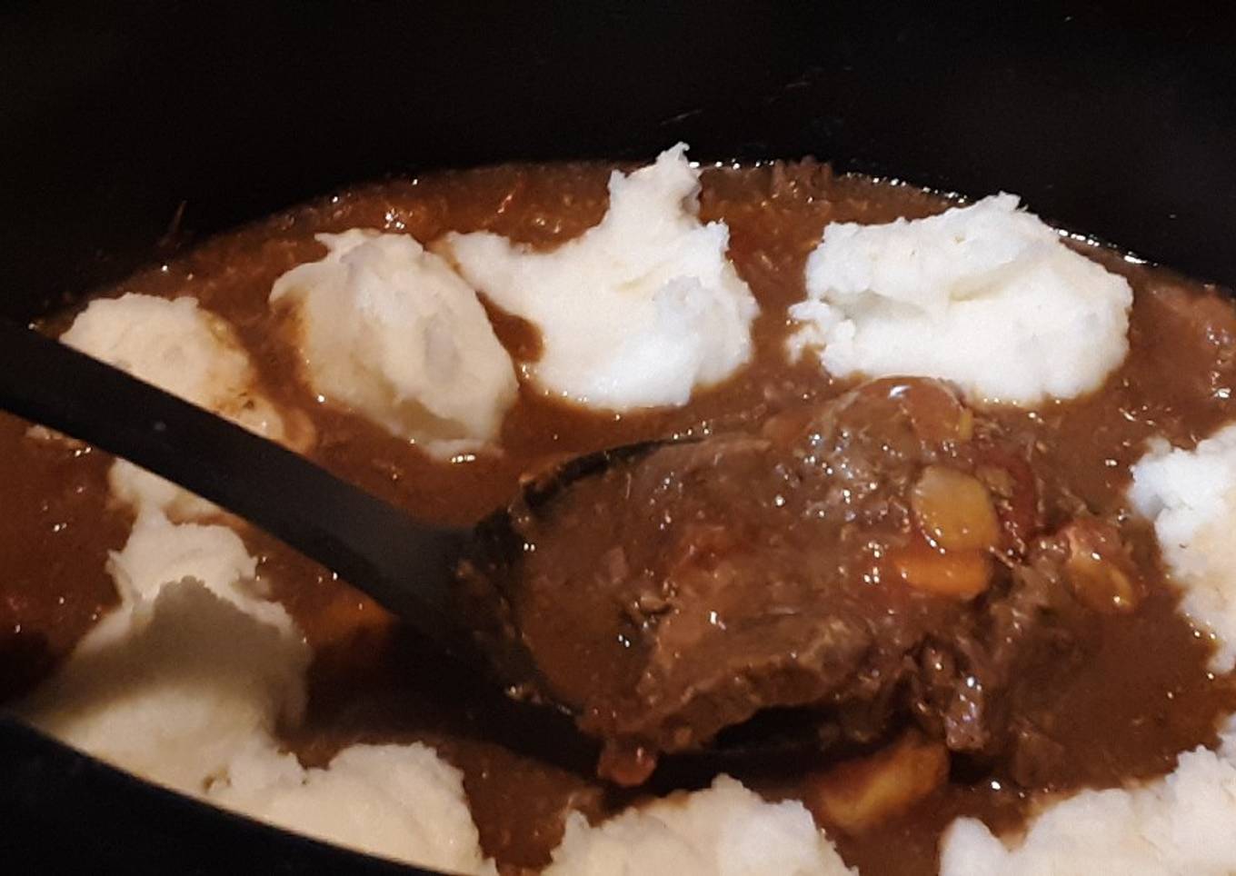 Swiss steak with potatoes in a slow cooker