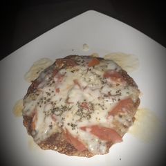A picture of Masala oats cheela pizza.