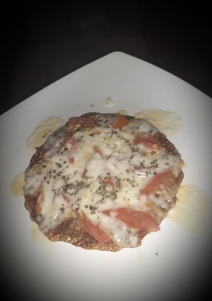 A picture of Masala oats cheela pizza.