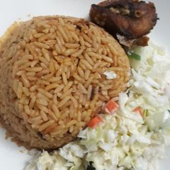 A picture of Jollof rice and coslaw.