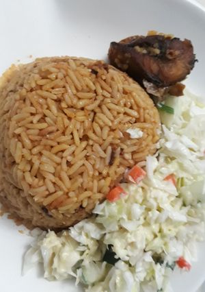 A picture of Jollof rice and coslaw.
