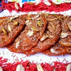 A picture of Kesari Gajar Malpua.