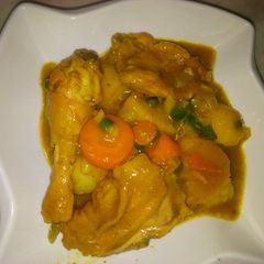 A picture of Potato and chicken with veggies.