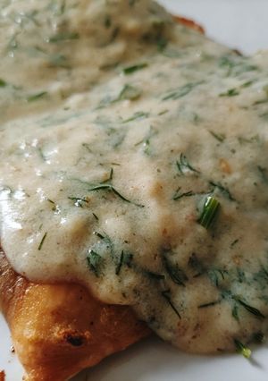 A picture of Salmon with Sauce.