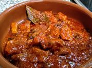 Una foto de magro de cerdo con tomate