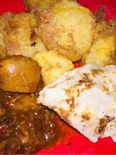 A picture of Sweet potatoes and cowtail sauce.