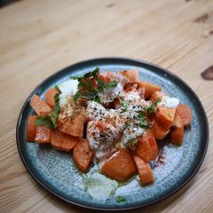 A picture of Sweet Potatoes with yogurt seasoning.