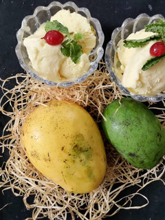 A picture of Raw mango and ripe mango ice cream.