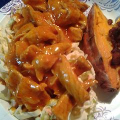 A picture of Onion barbecue pork with homemade coleslaw and sweet potatoes.