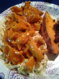 A picture of Onion barbecue pork with homemade coleslaw and sweet potatoes.