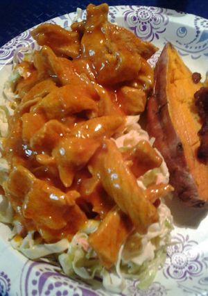 A picture of Onion barbecue pork with homemade coleslaw and sweet potatoes.