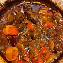 A picture of Beef stew in a Dutch Oven.