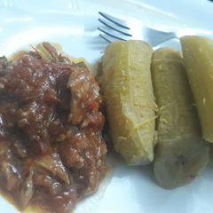 A picture of Plantain with tomato mushroom sauce.