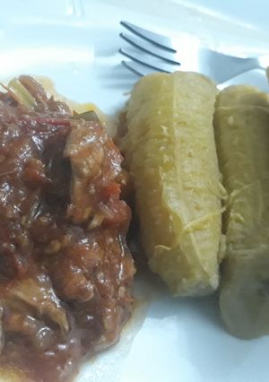 A picture of Plantain with tomato mushroom sauce.