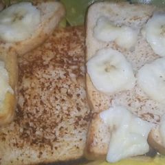 A picture of French toast bread with banana.