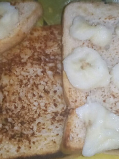 A picture of French toast bread with banana.