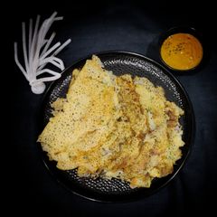 A picture of Healthy Rava dosa with methi tomato chutney.