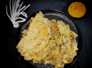 A picture of Healthy Rava dosa with methi tomato chutney.