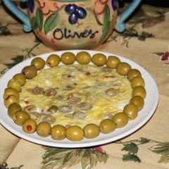 A picture of Spanish Omelet with Olives & Red Pepper.